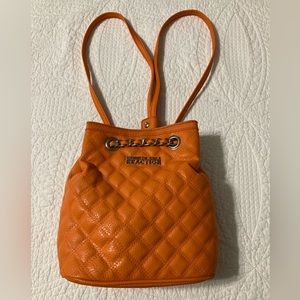 Kenneth Cole Reaction mini back pack. Never used. Color is orange.